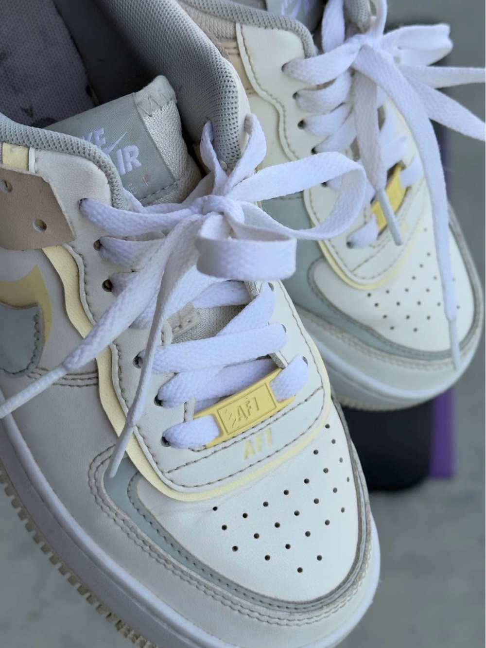 Nike Women's Low-Top Sneakers in White with Pale Yellow Accents
